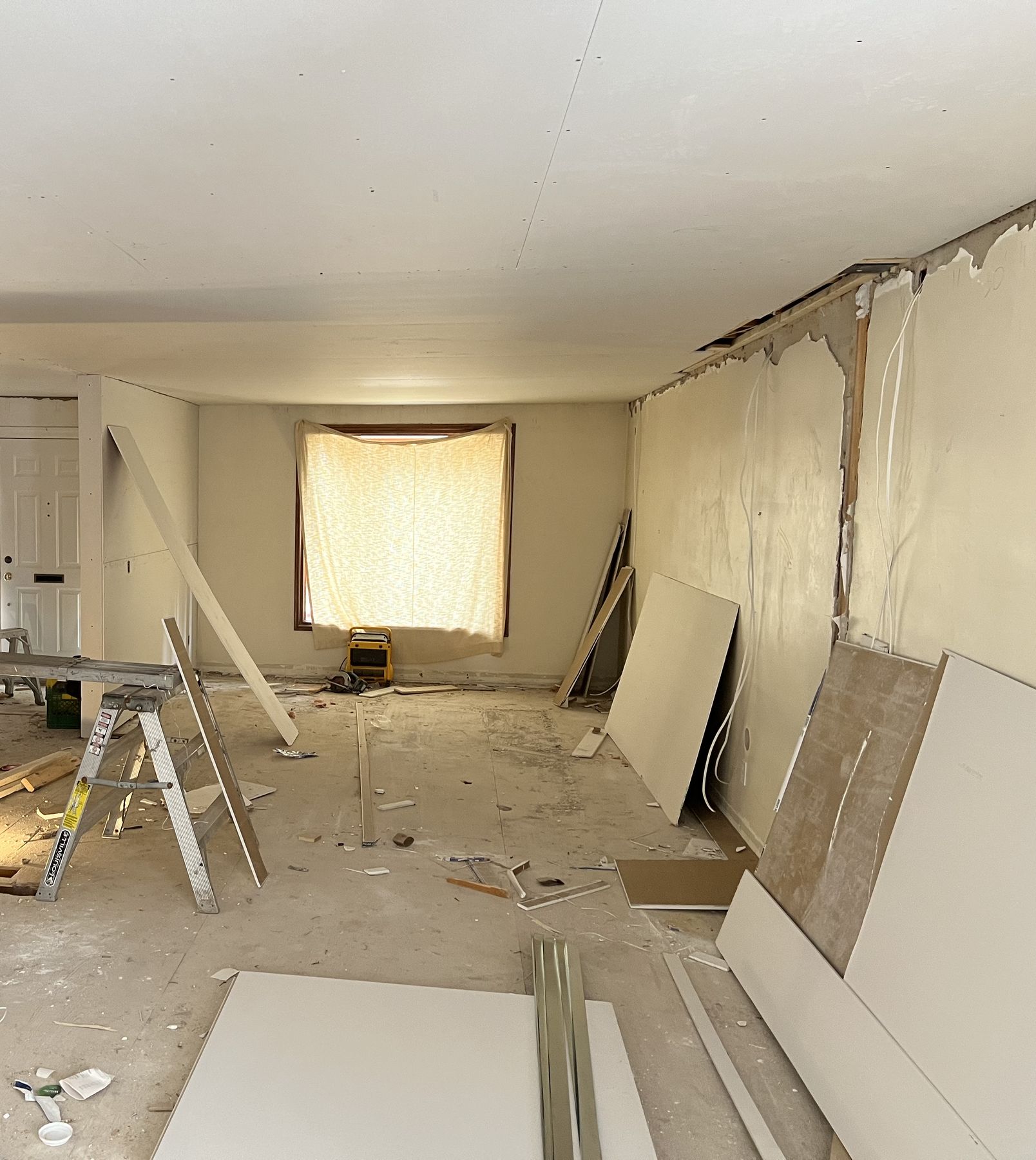 Main floor opened up during renovation, with new drywall going on
