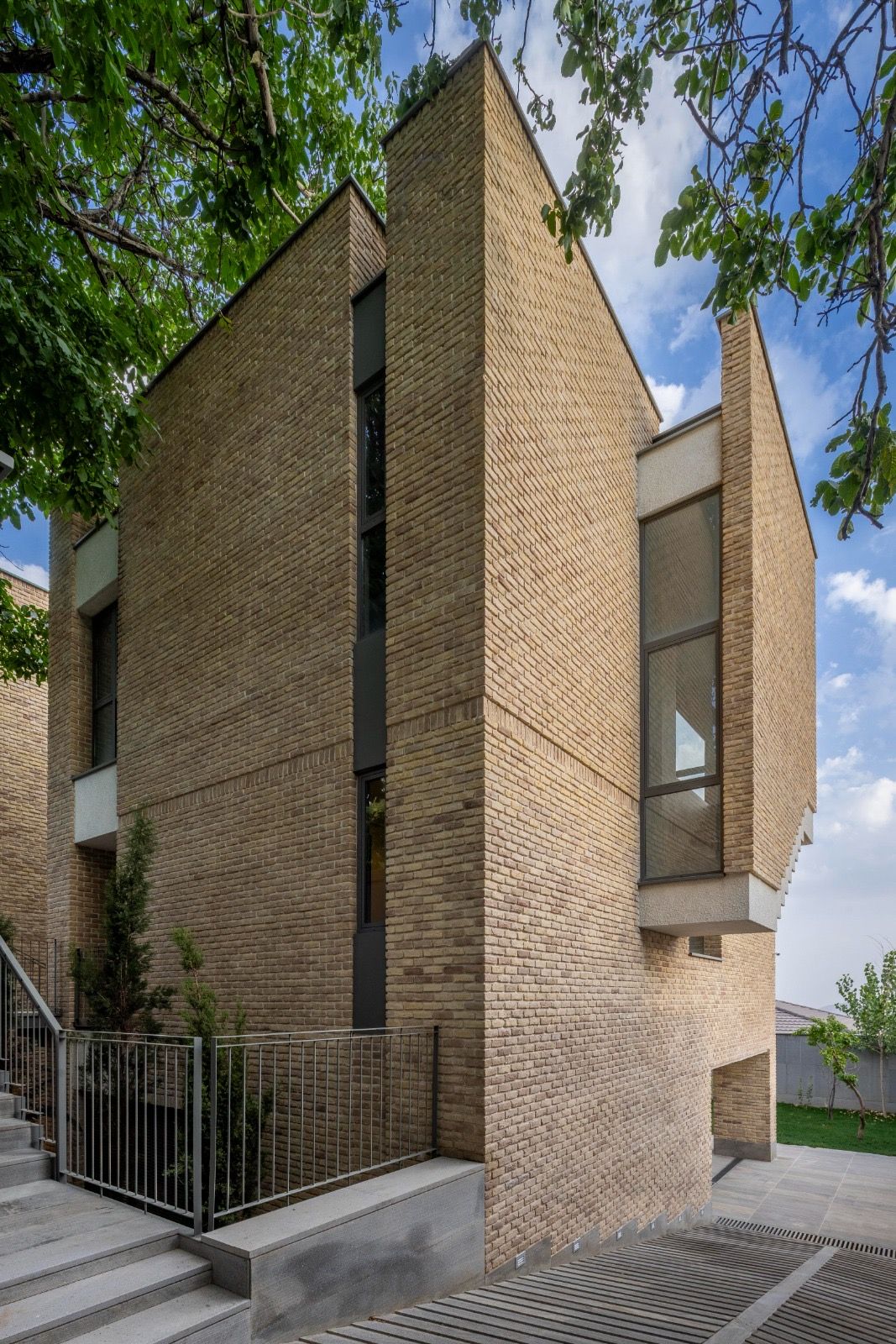 Tall brick house seen from the street